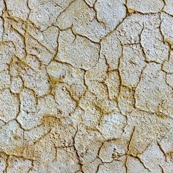 Seamless texture of plaster on a wall with cracks