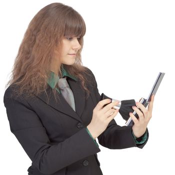 The woman corrects cosmetics on the face, isolated on a white background