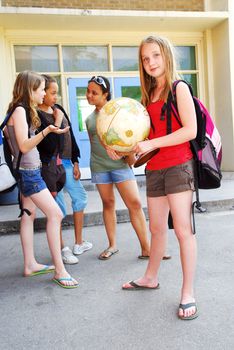 Group of young girls near school building