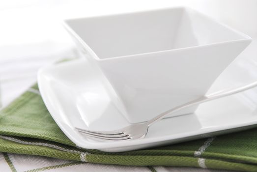 Place setting of white plate and bowl 