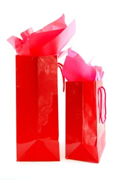 Two red shopping bags isolated on white background
