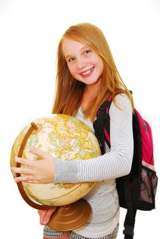 Young smiling school girl with backpack and globe isolated on white background