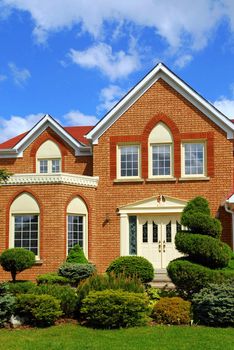 Residential house with beautiful landscaping in front yard