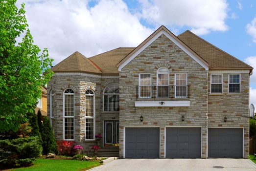 Big luxury residential house with natural stone facing