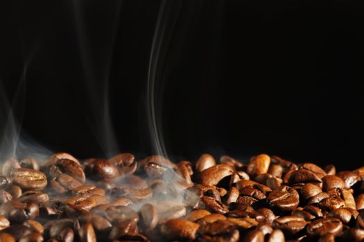 roasting coffee with smoke and black background