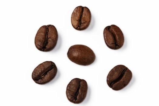 closeup of one coffee bean surrounded by other coffee beans
