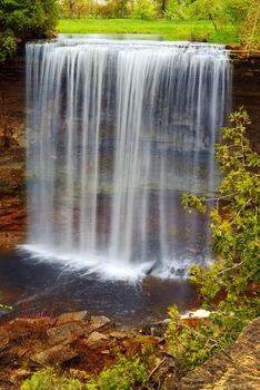 Beautiful waterfall flowing over natural rock formation