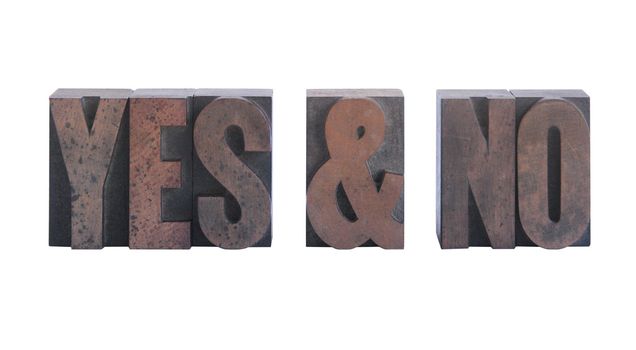 the words 'yes & no' in old ink-stained wood type