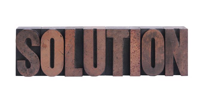 the word 'solution' in old ink-stained wood type