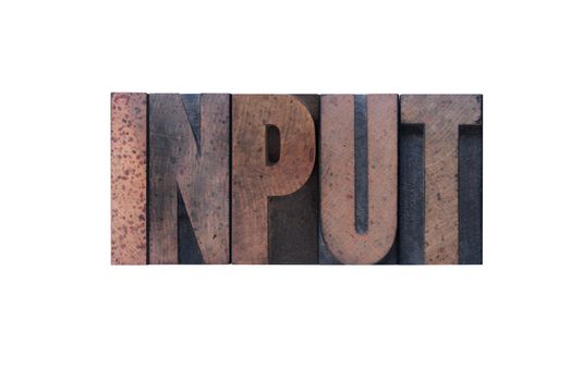 the word 'input' in old ink-stained wood type 
