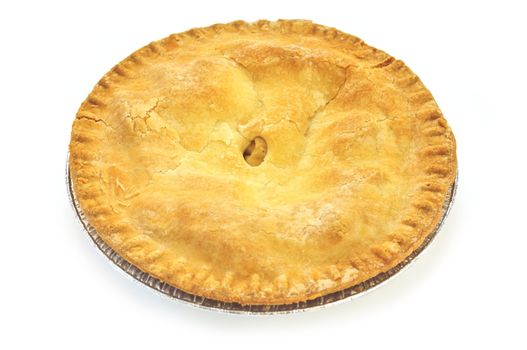 Whole apple pie isolated on white background