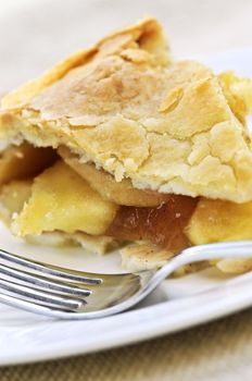 Slice of fresh apple pie on a plate