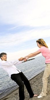 Mature romantic couple having fun on a beach