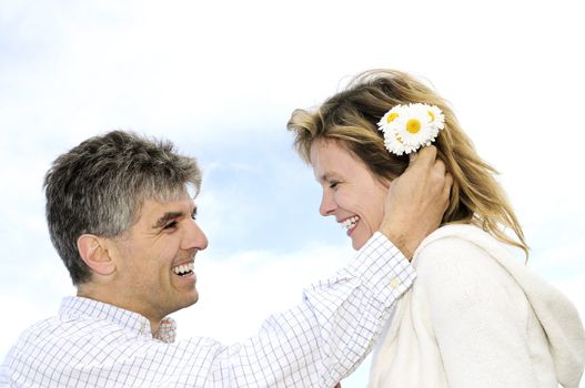 Mature couple enjoying a romantic moment with flowers