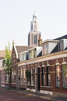 Old Dutch houses with churchtower in the background