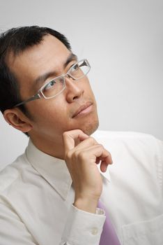 Mature business man thinking, closeup portrait of Asian.