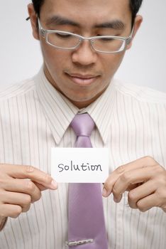 Manager want solution and holding one card with words.