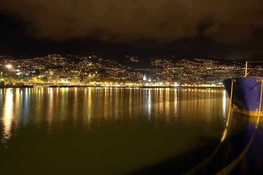 Night photo of a city by the sea in Funchal
