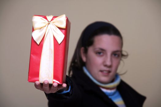 young girl giving gifts (focus on the present)