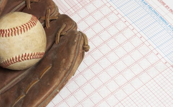 a picture of a ball and glove on a scorebook