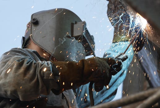 a metal welder busy at work