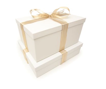 Stacked White Gift Boxes with Gold Ribbon and Bow Isolated on a White Background.