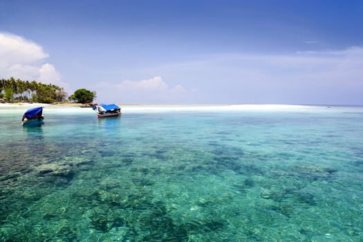 Image of the open sea and part of a remote Malaysian tropical island.