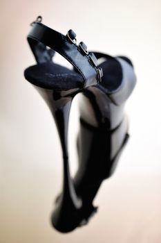 Black patent-leather shoe, on high heel
