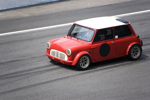 Image of a classic car racing at the South East Asian Classic Car Race, held at the Sepang International Racing Circuit on April 13, 2008.