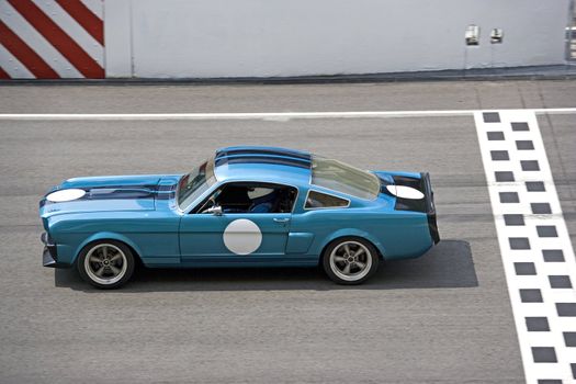 Image of a classic car racing at the South East Asian Classic Car Race, held at the Sepang International Racing Circuit on April 13, 2008.