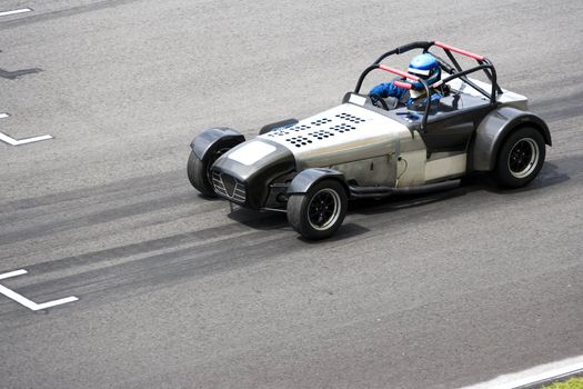 Image of a classic car racing at the South East Asian Classic Car Race, held at the Sepang International Racing Circuit on April 13, 2008.