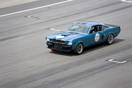 Image of a classic car racing at the South East Asian Classic Car Race, held at the Sepang International Racing Circuit on April 13, 2008.