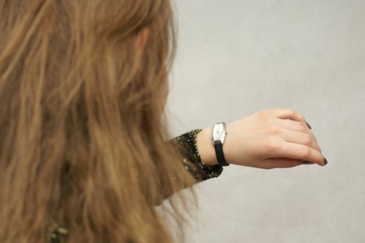 Young beautifful gril from Poland with watch in isolated photo. Home Photo Studio Sony Alpha 700
