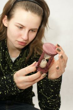 Young beautifful gril from Poland with watch in isolated photo. Home Photo Studio Sony Alpha 700