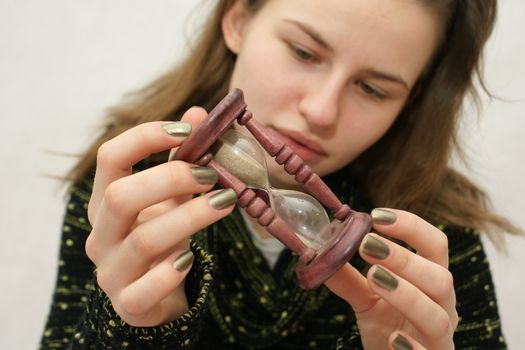 Young beautifful gril from Poland with watch in isolated photo. Home Photo Studio Sony Alpha 700