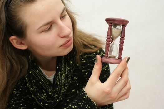 Young beautifful gril from Poland with watch in isolated photo. Home Photo Studio Sony Alpha 700