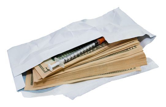 Stack of dollars and syringe in open envelope isolated on white. Clipping path included. Concept of drug, expensiveness of medical care, illegal proffit, racketeering.
