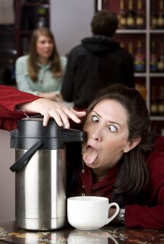 Woman drinking coffee directly from a beverage dispenser