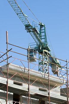 View of a new building with a yellow crane