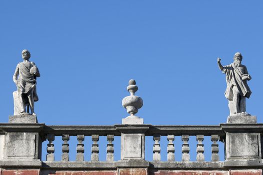 Statues and fieze of an italian building rooftop