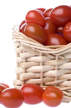 Isolated image of cherry tomatoes in a basket.