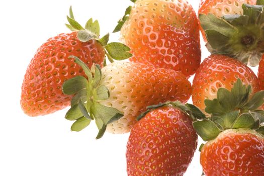 Isolated macro image of strawberries.