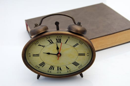 Isolated old hours and brown book 