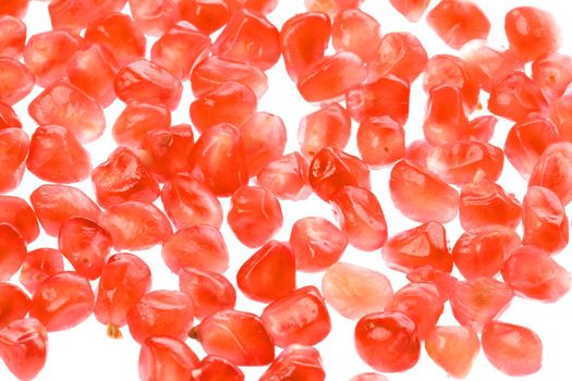 Isolated macro image of Pomegranate seeds.