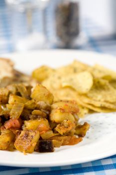 Simple Indian meal with naan bread and chappati crisps