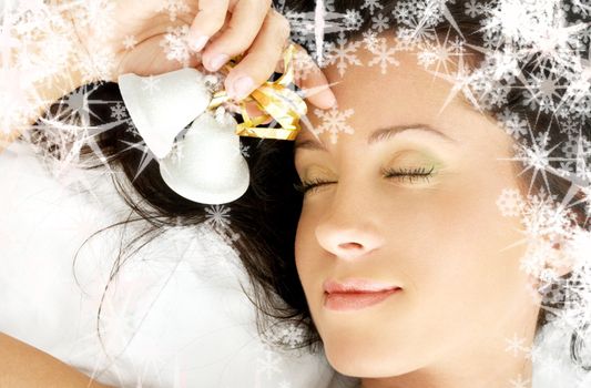 dreaming girl with christmas bells and rendered snowflakes