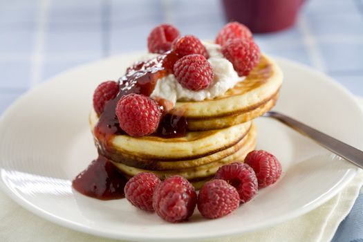 Delicious pancakes with ricotta cream and raspberries