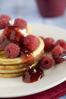 Delicious pancakes with raspberries and jelly