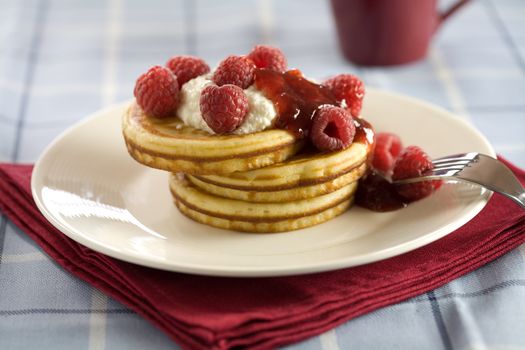 Delicious pancakes with ricotaa and raspberries