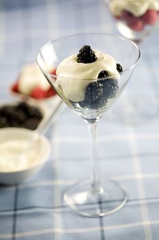 Dessert with blackberries and whipped cream